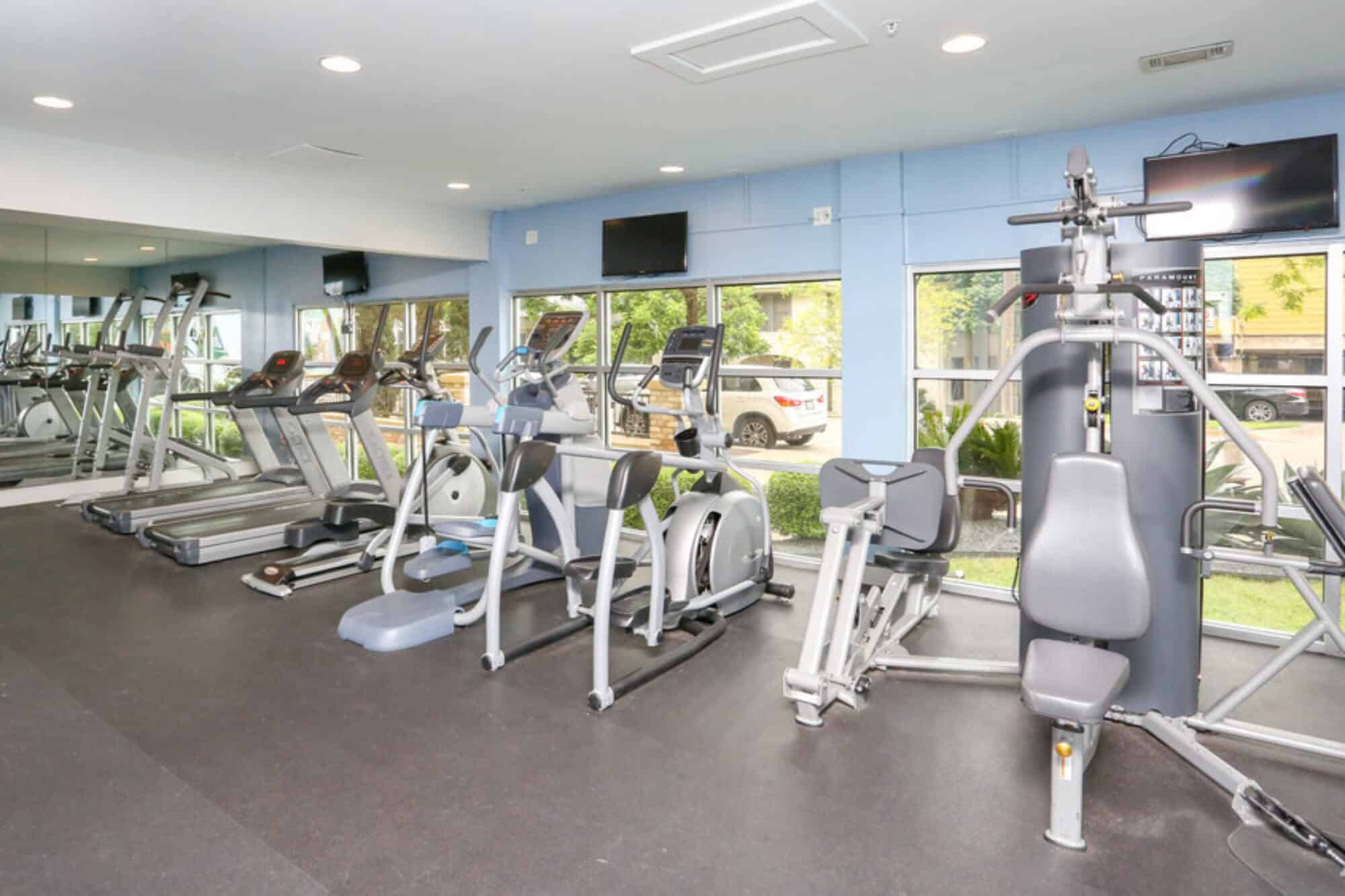 villas on guadalupe off campus apartments near ut austin resident clubhouse fitness center machines and equipment